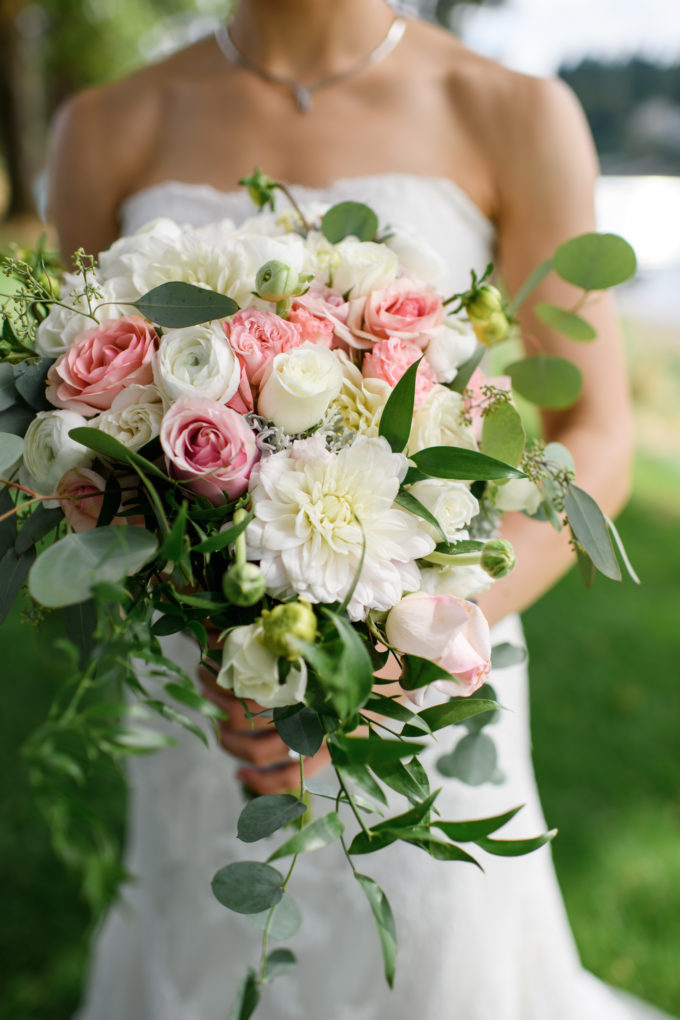Picture of bride with Lake Oswego wedding flowers arrangement from Lake Oswego Flowers