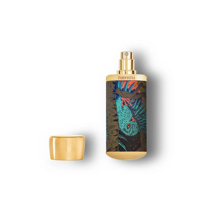 Perfume bottle with gold cap and colorful label on a white background